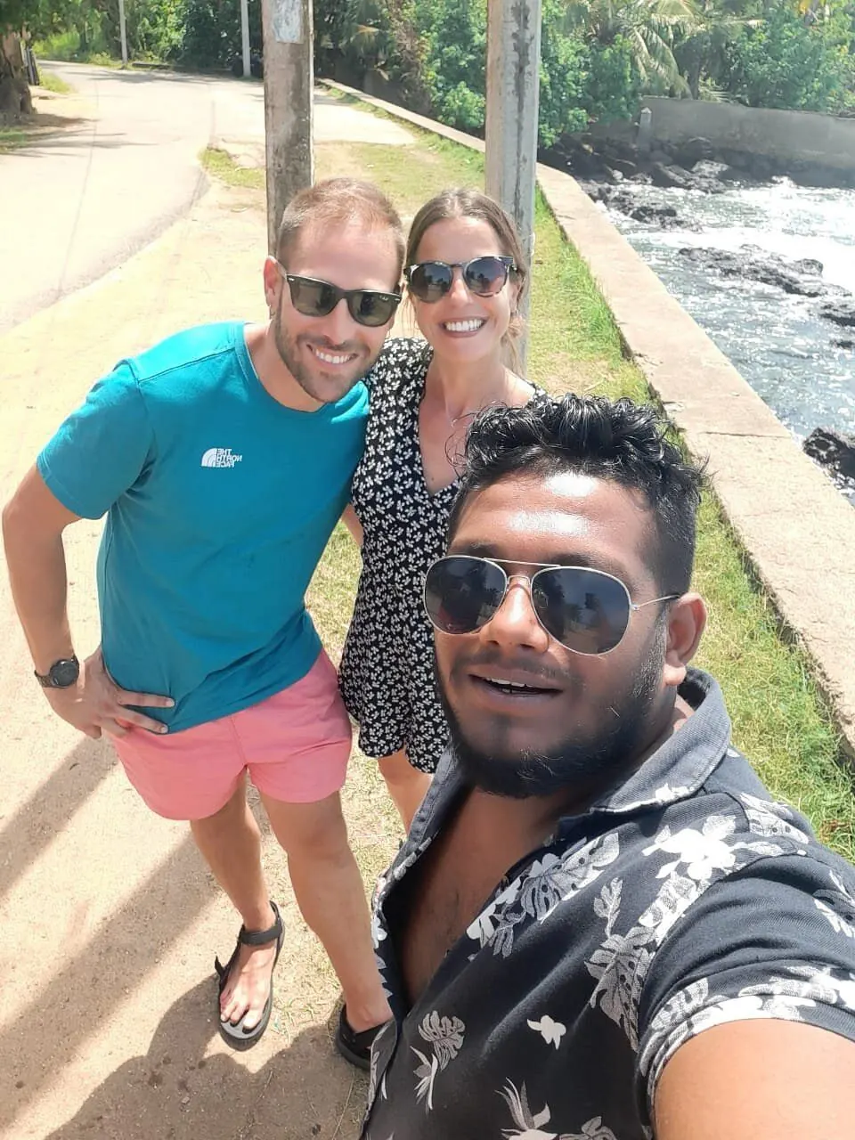 Dinu with a couple by a river